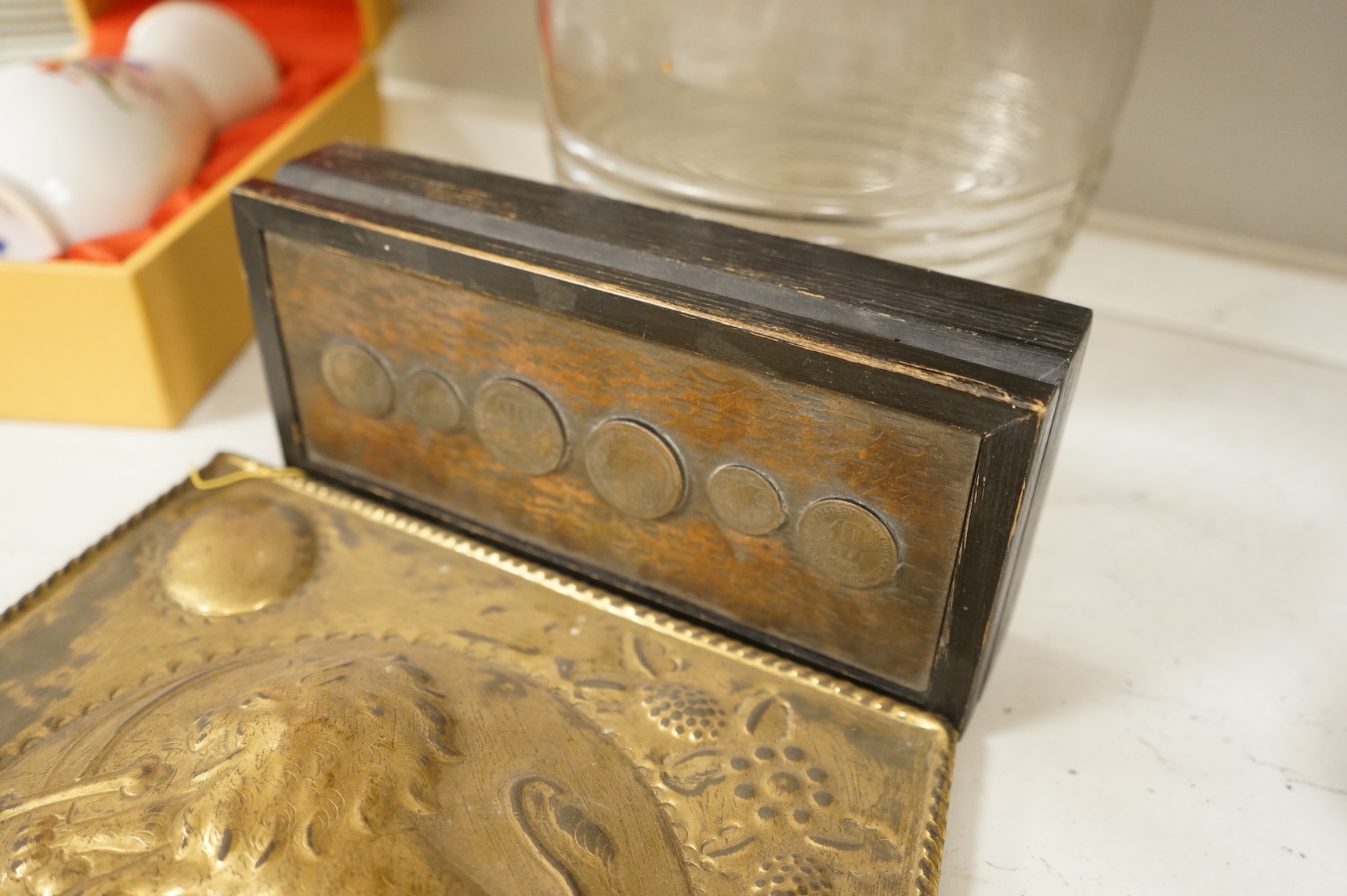 A Victorian glass spirit barrel, converted to a lamp base, together with a pair of embossed sheet-brass heraldic plaques and a replica coin set box